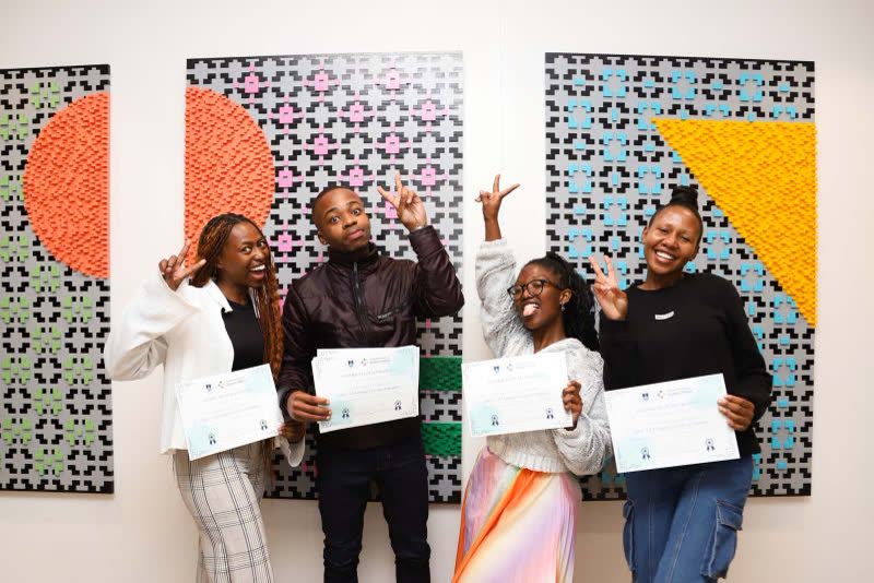 Newly registered candidates with their certificates